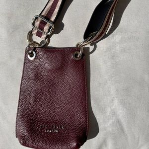 Charming deep purple leather Ted Baker small bag with magnetic closure.